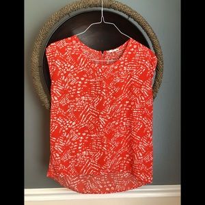 Orange and white hi low cap sleeve blouse.